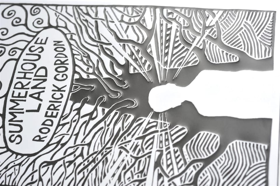 Close-up of the jacket showing the hand-lettered title inside its oval and the surrounding branches.
